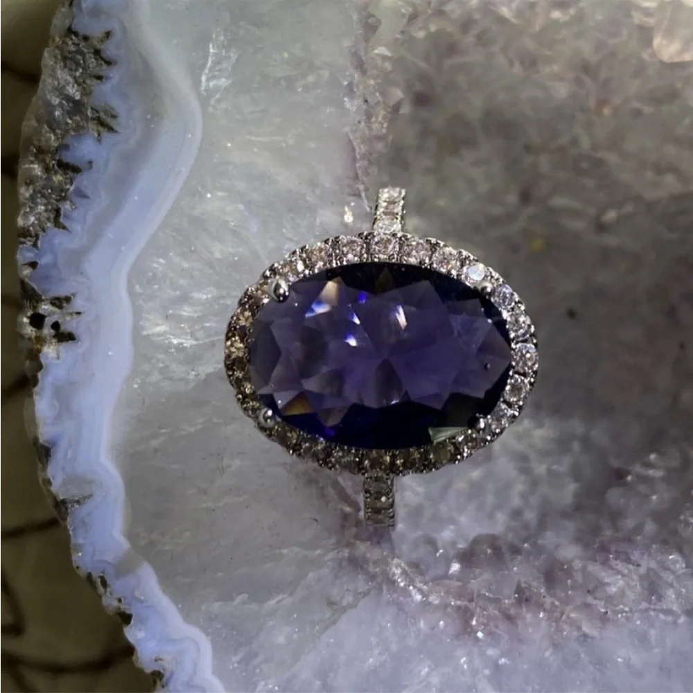 Sterling Silver amethyst prong set cocktail ring with gemstone halo bezel
